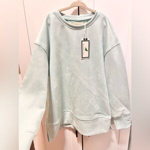 The properly tied Light Mint Crewneck Sweatshirt